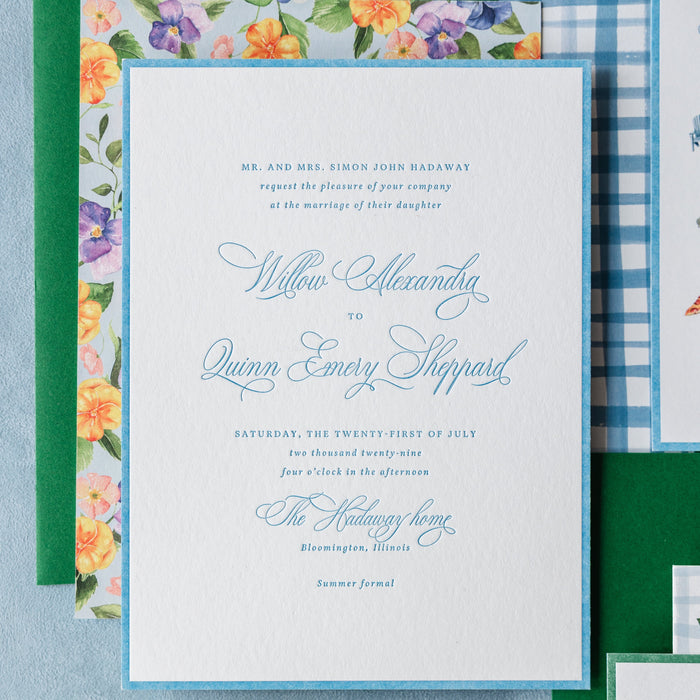 Hadaway v2 wedding invitation set with floral and checkered designs on a blue background