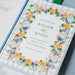 Wedding invitation with floral design and 'Save the Date' text on a checkered background