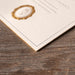 Corner Detail of Charmain Wedding invitation showing gold foil edge
