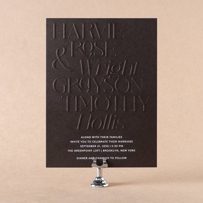 Harvie wedding invitation with embossed text on a beige background