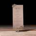 Menu card on a stand with decorative elements against a dark background