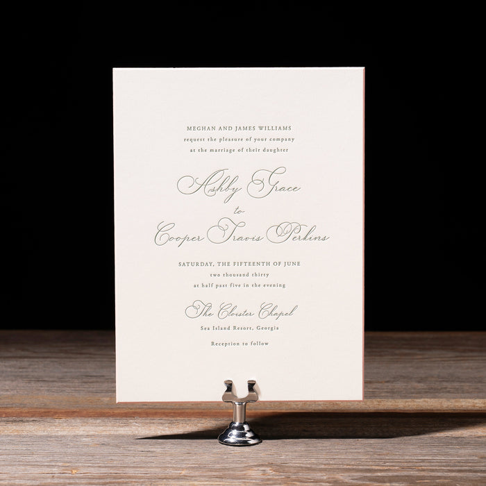 Ashby Wedding invitation card on a stand with a black background