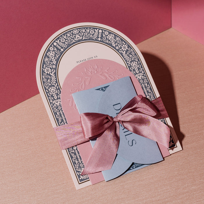 Decorative card with a pink bow on a pink and brown gradient background