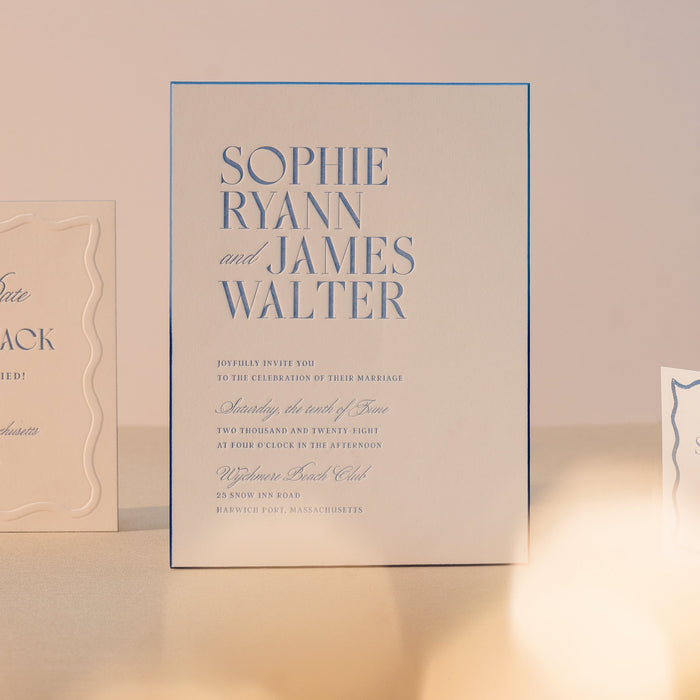 Ryann Wedding invitation cards with 'Save the Date' and 'SOPHIE & JAMES' text on a soft pink background.
