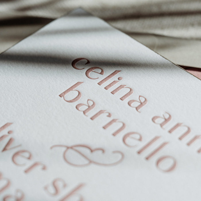 Close-up of a Celina wedding invitation embossing.