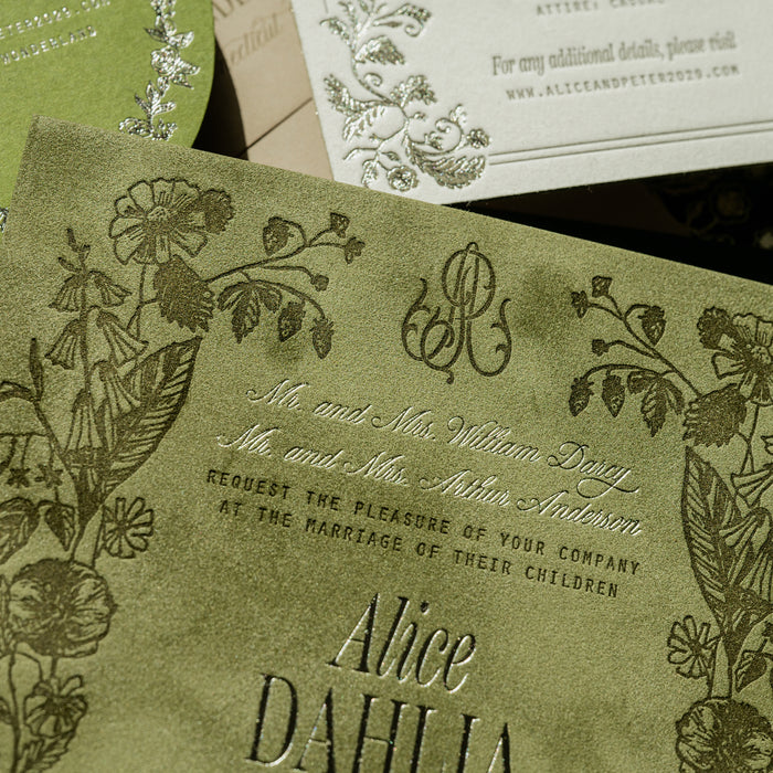 Vintage-style wedding invitation with floral designs and monogram on a green background