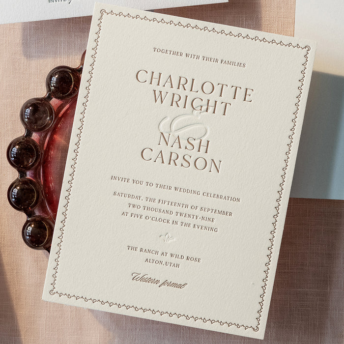 Nash Wedding invitation card with elegant design on a textured surface