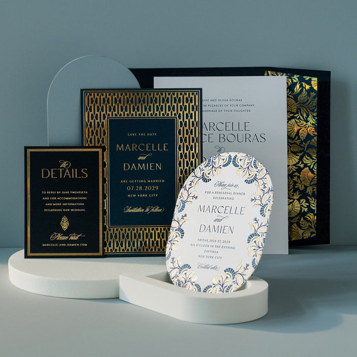 Collection of personalized stationery items on a gray surface with a blue gradient background