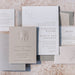Set of elegant wedding invitations from Sedna Suite with shell designs on a textured surface