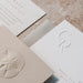 Three beige and white cards from the Sedna Suite with embossed designs and text on a textured surface
