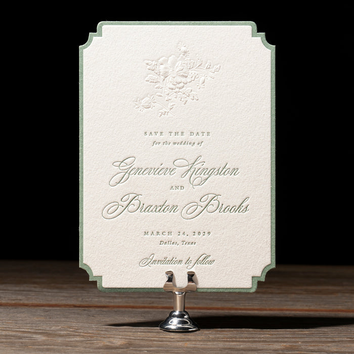 Braxton v2 save the date card on a stand with a dark background