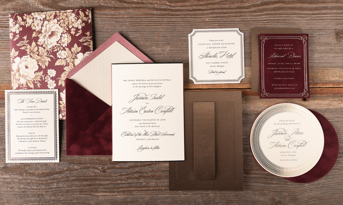 Canfield wedding invitation suite on wooden surface