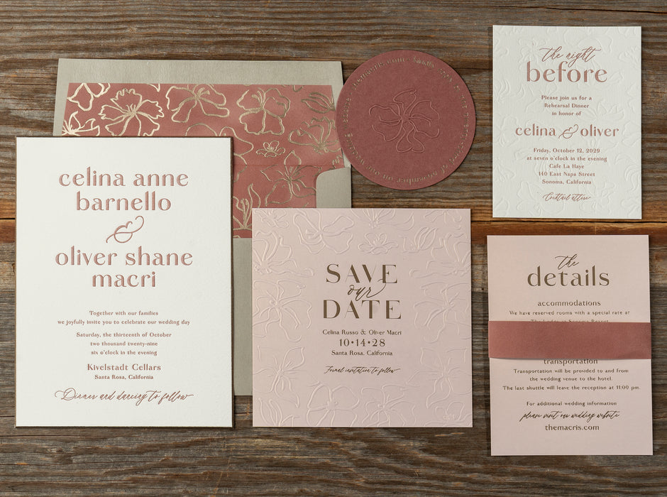 Celina wedding invitation suite on a wooden surface