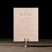Celina details card on a stand against a dark background