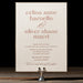 Celina wedding invitation on a stand against a dark background