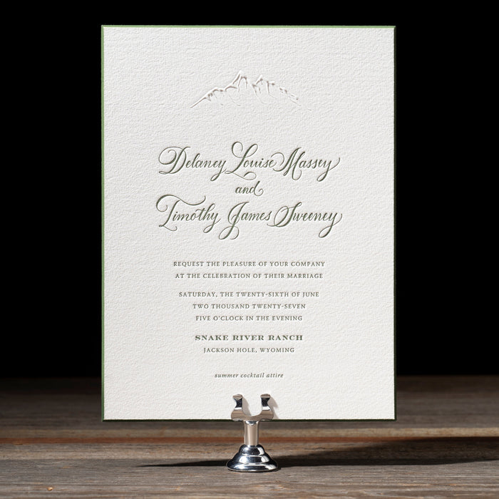 Cheyenne wedding invitation card on a stand with a black background