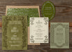 Set of green and beige wedding invitations from the Darcy suite on a wooden surface