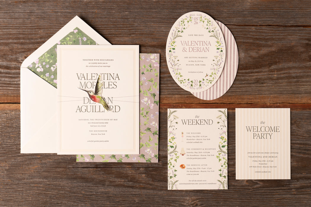 Derian v2 wedding invitation suite on wooden background