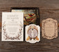 Vintage-style Devonshire wedding invitation set with nature-themed design on a wooden surface