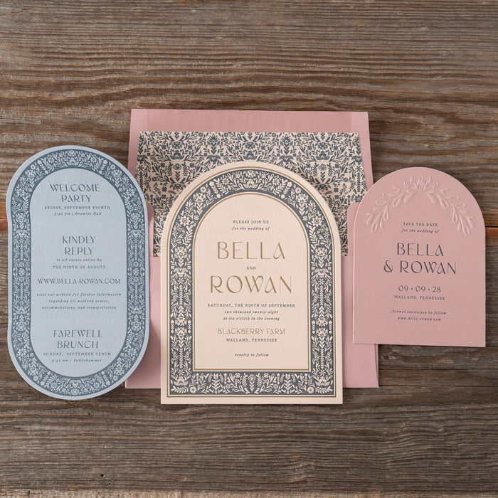 Decorative wedding invitations on a wooden surface