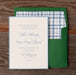 Hadaway v2 wedding invitation card with green envelope on a wooden surface