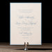 Wedding invitation card on a stand with a dark background