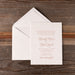 Heaton Wedding invitation card with envelope on a wooden surface