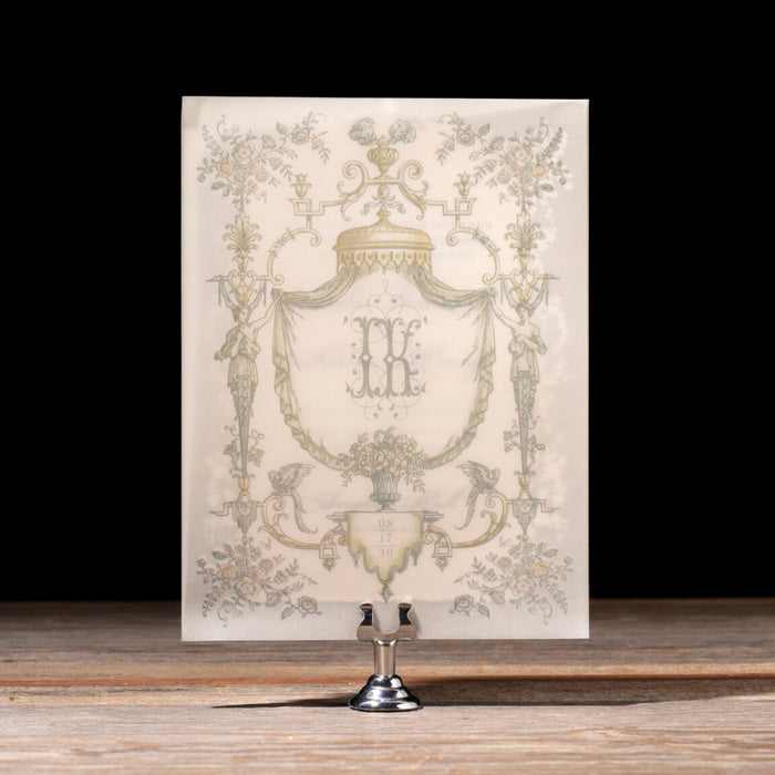Decorative card with intricate design on a stand against a black background