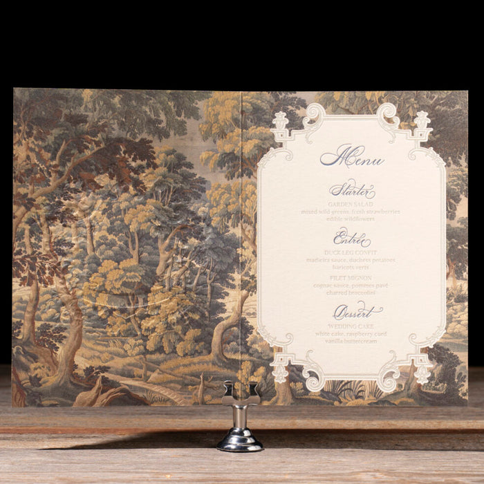 Decorative menu with nature-themed design on a wooden surface