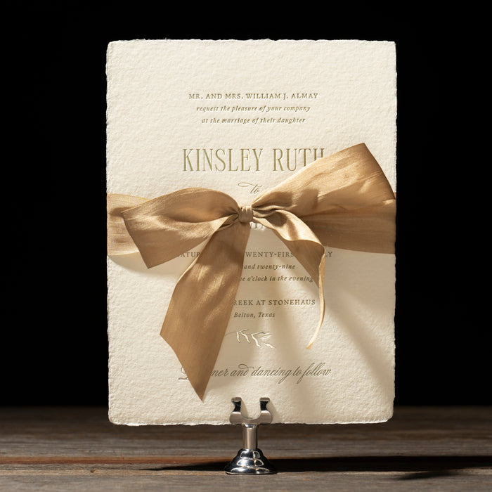 Kinsley wedding invitation handmade card with silk ribbon tied in bow.