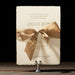 Kinsley wedding invitation handmade card with silk ribbon tied in bow.