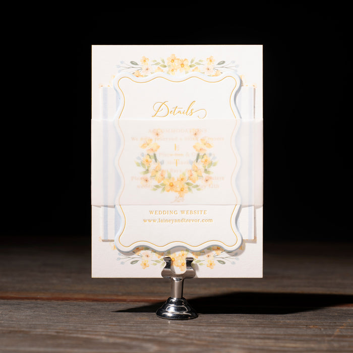 Decorative card on a stand with gold accents against a dark background
