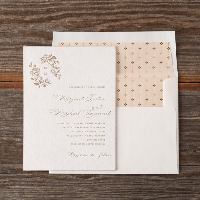 Wedding invitation card with envelope on a wooden surface