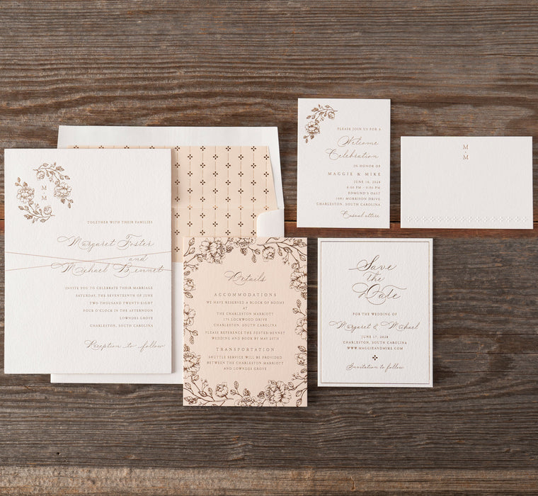 Set of wedding invitations on a wooden surface