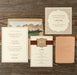 Nash wedding invitation suite and save the date card on a wooden surface