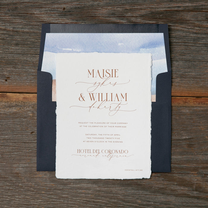 Wedding invitation with envelope on a wooden surface