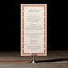 Royce menu card with decorative border on a stand against a dark background