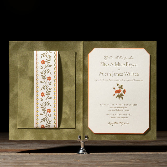 Royce wedding invitation with floral design on a dark background