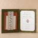 Decorative Royce wedding invitation with floral patterns on a beige background