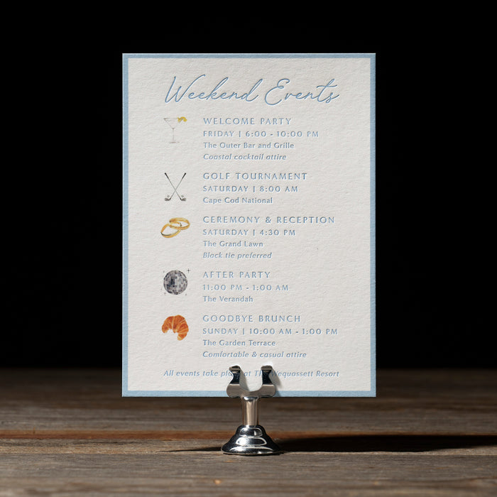 Event schedule card on a stand with a dark background