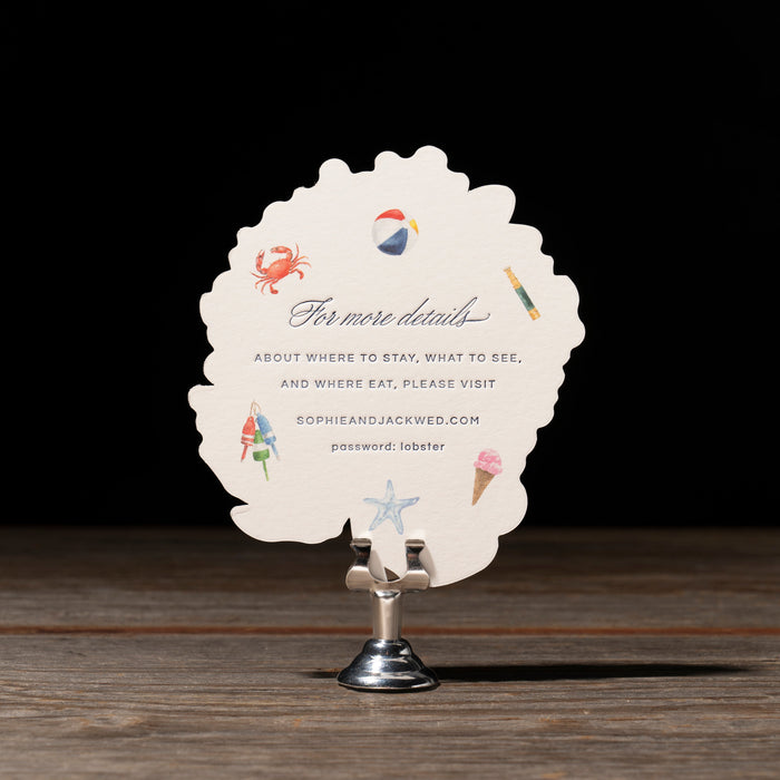 Round white details card with colorful graphics and text on a stand against a dark background